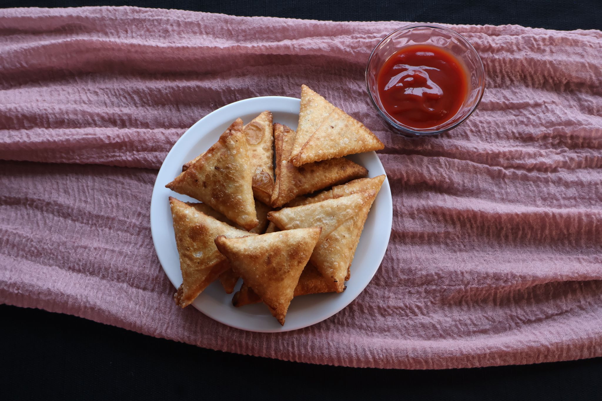Golden samosas fresh from the fryer